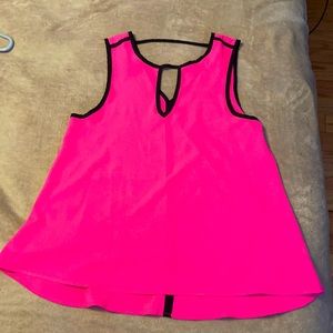 Sleeveless tank top. It is size Medium and hot pink with black trim.